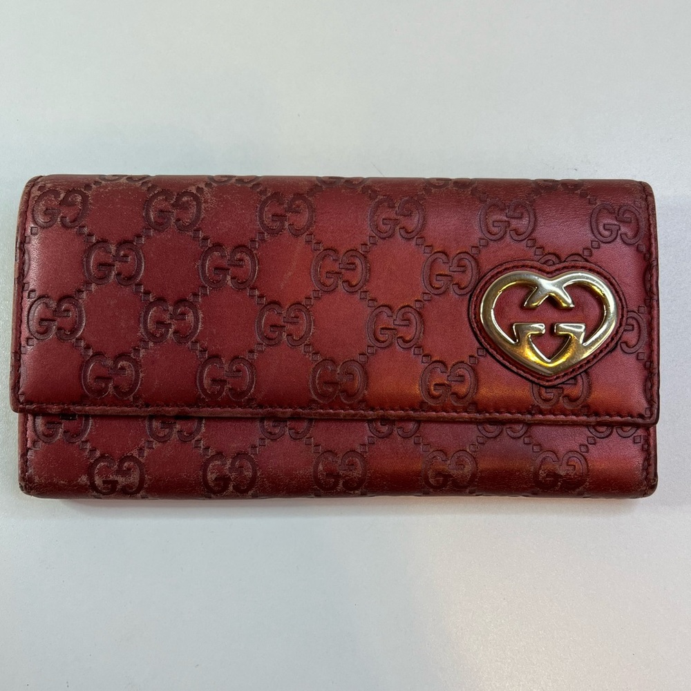 GUCCI Metallic Magenta Chromed Embossed Guccissima
Leather Wallet
